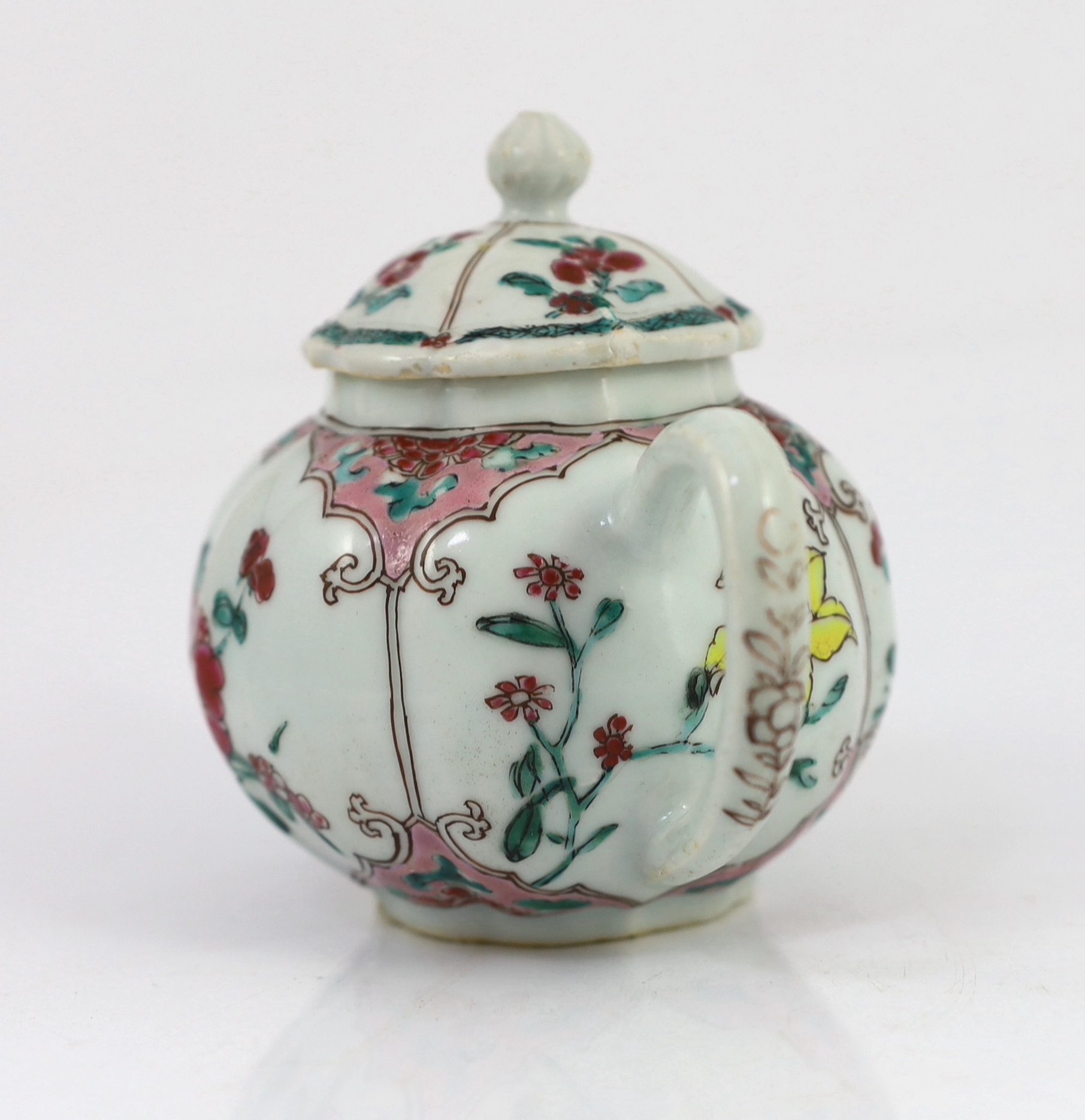 A Chinese famille rose petal lobed teapot, Yongzheng period, minor faults